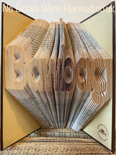 Load image into Gallery viewer, &quot;Bawbag&quot; hand folded into the pages of book : : Offensive Art : : Crude Books
