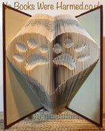 Two inverted paws within a heart