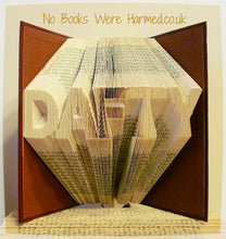 Load image into Gallery viewer, &quot;DAFTY&quot; hand folded into the pages of book : : Offensive Art : : Crude Books

